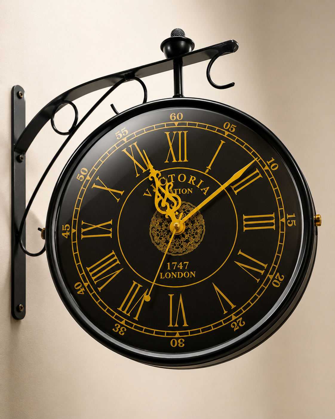 Close view of black frame and gold Roman numeral dial